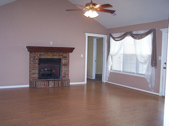 Living with vaulted ceiling and large windows