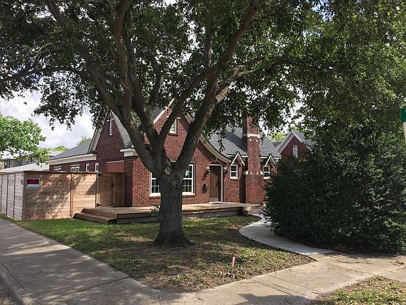 curved path to front door under mature oak shade tree
