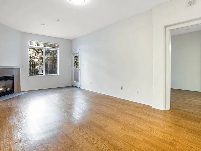 Living Room with Fireplace and Balcony