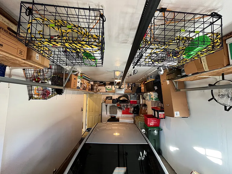 Garage large enough for car, chest freezer (not included), and garbage cans... All connected to an interior hallway so you don't have to get cold/wet outside!