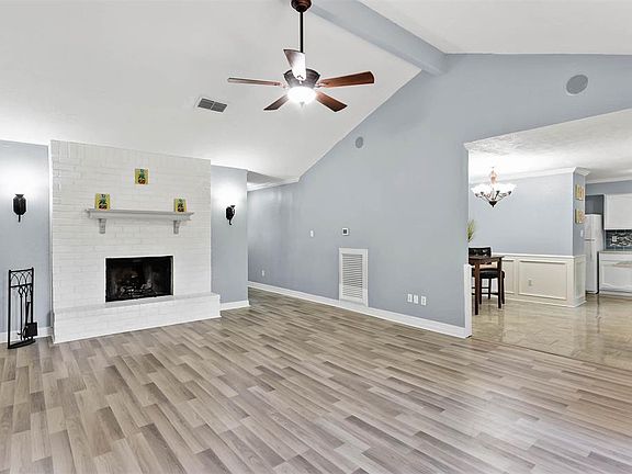 Cozy Wood Burning Fireplace. Open to Dining and Kitchen