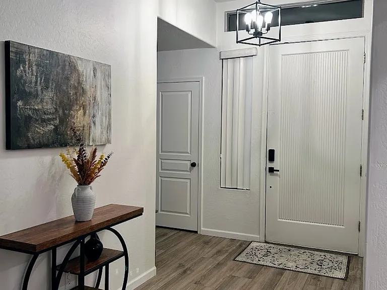 Entry way with updated light fixture for a modern look.