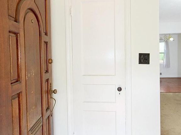 Foyer with original wood door