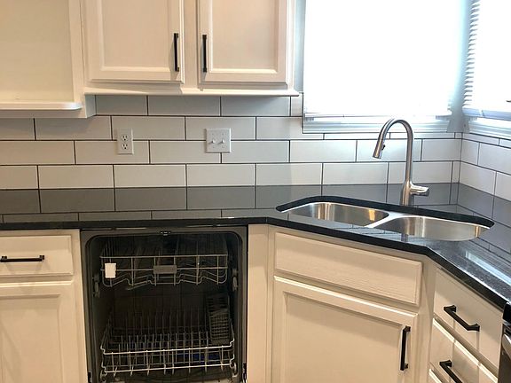 stainless steel dishwasher. updated kitchen faucet.