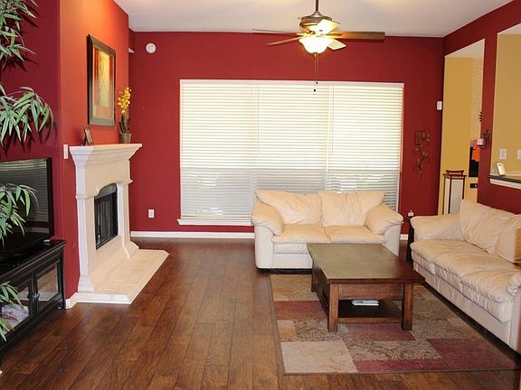 Spend quality family time in this den. Feel the warmth from the wood laminate floors and stone fireplace.