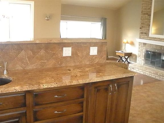 Kitchen overlooking island into living room