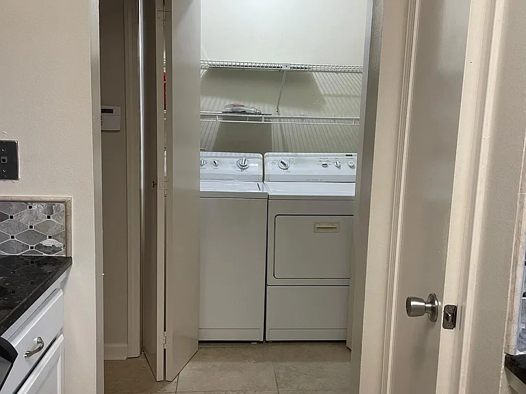 Laundry area with new washer/dryer off kitchen