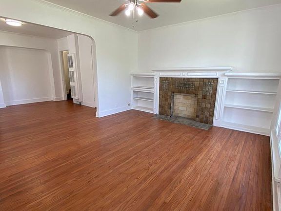 Living room with Spanish style faux fireplace and built-ins