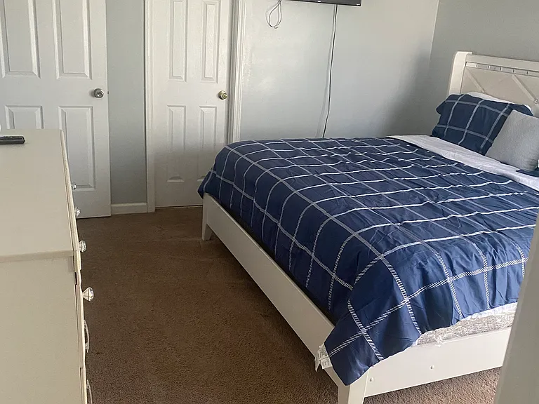 Second bedroom
King Bed
6 drawer dresser 
Walk-in closet
Smart Roku TV