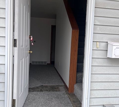 Front entry split view. Welcomes you to the living room and upstairs