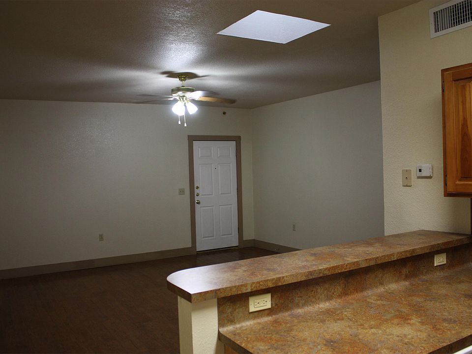Living/dining area overlooking kitchen bar.