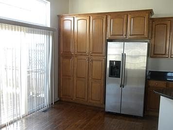 Kitchen showing sliding door to deck