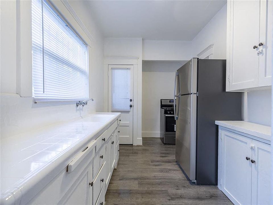Kitchen view with stainless steel fridge