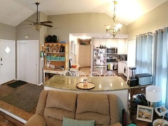 Entry way, hall closet and eat in kitchen (with storage under the island)