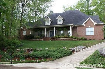 Front of house from cul-de-sac : Treed lot, professional landscaping. New roof/gutters in 2008. 3-ca