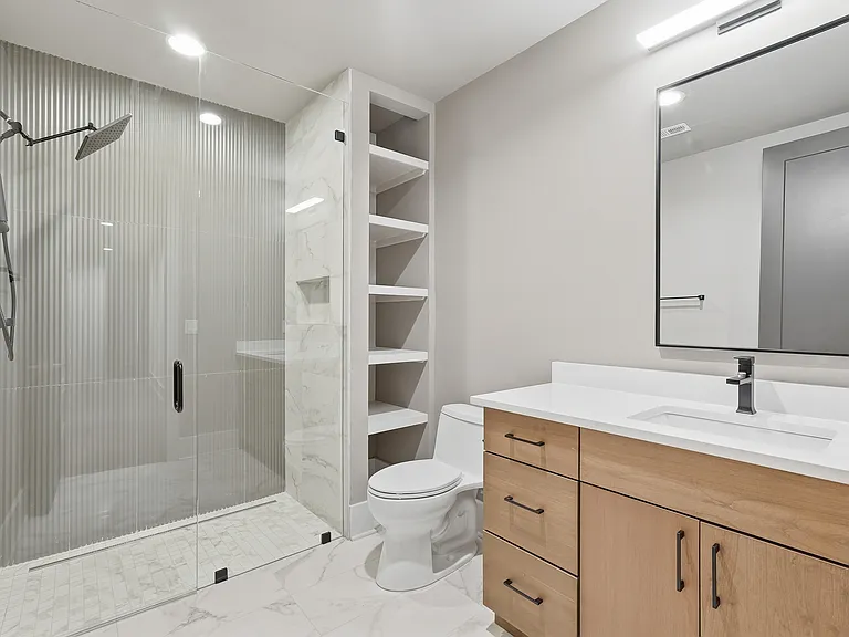 Bathroom with built in storage and sleek finishes