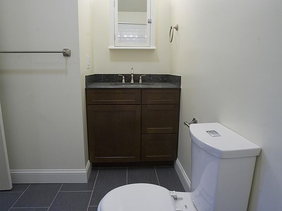 Bathroom with dual flush toilet