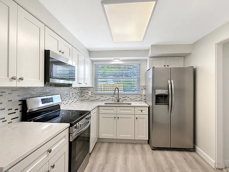 Refrigerator features filtered water and ice dispenser in the door
