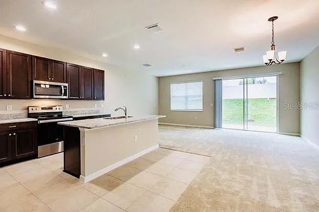 Building Photo - 6320 Tillandsia Pl