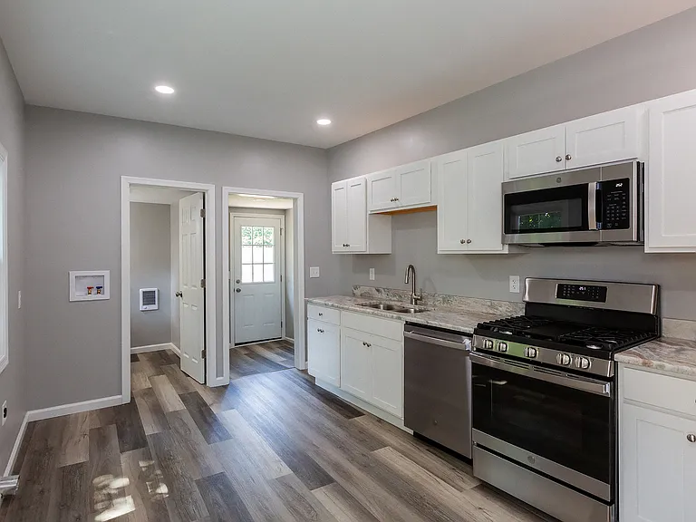 Remodeled Kitchen two years ago. Gas stove, dishwasher and granite countertops.