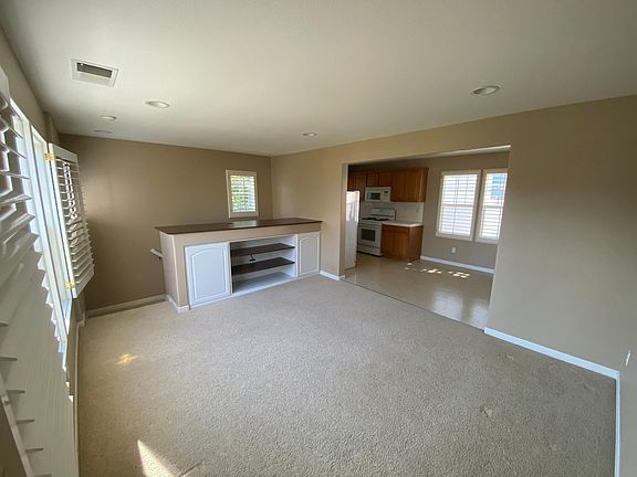 Main living room with kitchen and dining in the far end