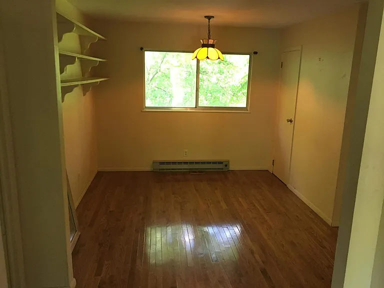 Dining or study room. Faces back wooded lot and nearby farm, lots of shelves and closet space