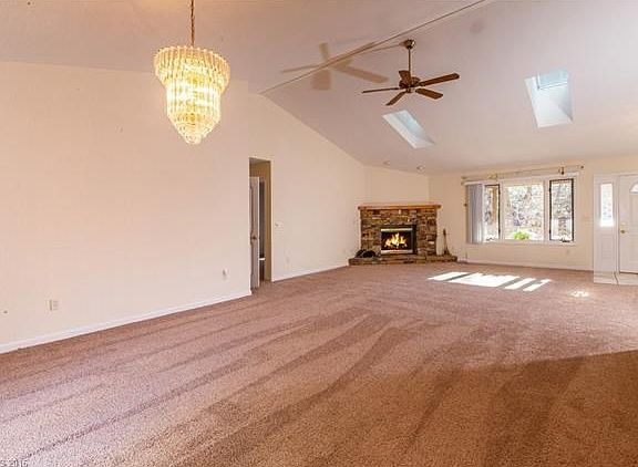 Spacious Living area with Vaulted Ceiling, Skylights & New Carpeting