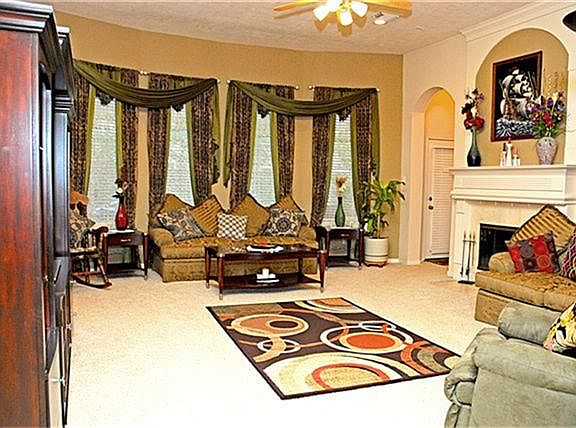Large Family room with custom built windows and gorgeous fireplace for entertaining