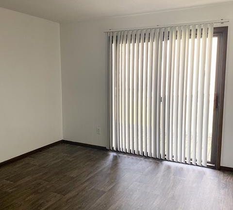 Additional view of family room and private balcony.