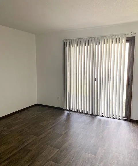 Additional view of family room and private balcony.