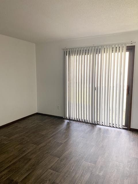 Additional view of family room and private balcony.
