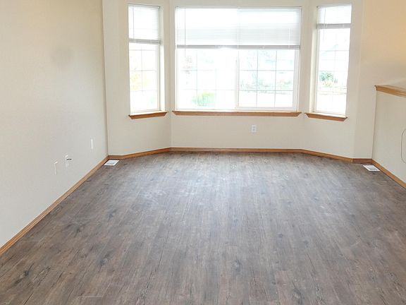 upstairs family room with new vinyl plank flooring and paint