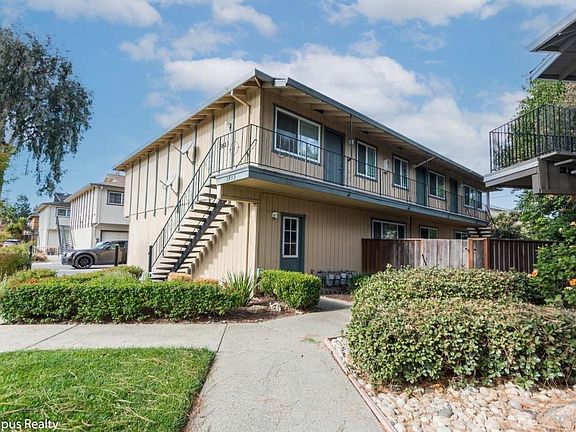 The unit is the green door on the 2nd floor in the middle. The front door overlooks a private side yard that you would have access to.