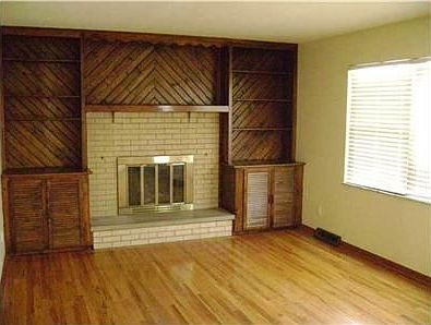 Built in cabinets, hardwood floors, and a wood burning Fireplace in LR.
