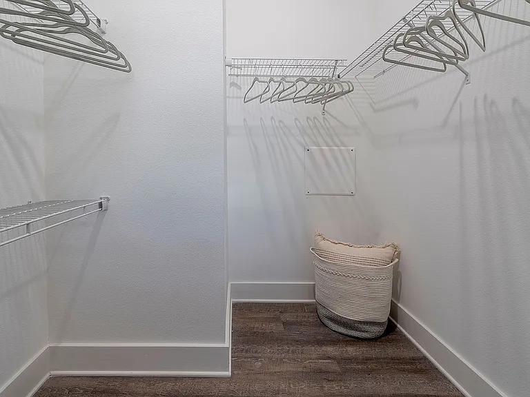 Explore the roomy walk-in closet, perfect for organizing your wardrobe in style.