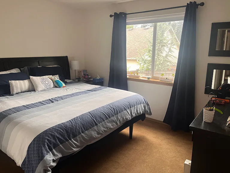 Enjoy total peace and privacy in this master bedroom featuring an en-suite bathroom and a spacious walk-in closet. The window looks out over the backyard, giving you a perfect, private view to watch the kids or pets play without anyone looking in!