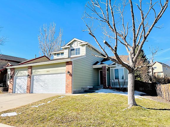 3 car garage, with big front yard and beautiful trees