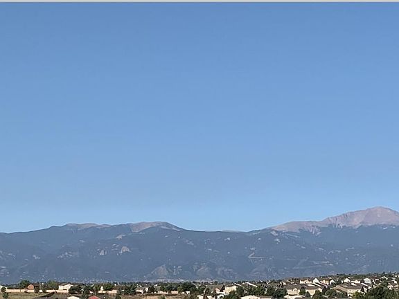 View from Rear Covered Patio/Deck - Pike's Peak and Surrounding Mountain Range