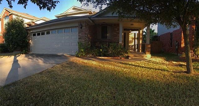 Front of house at sunset. House faces North & backyard faces South.