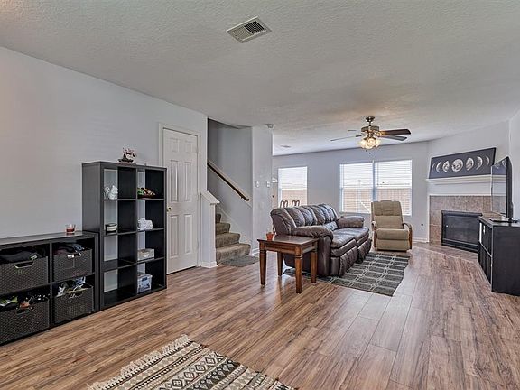 Large windows for lots of natural light and a cozy fireplace.