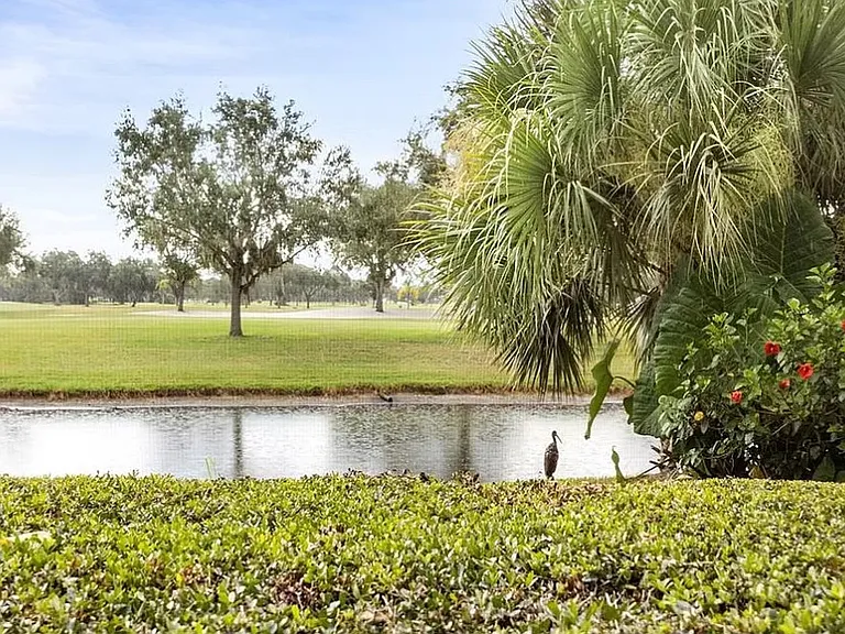 exterior view across canal to golf course.