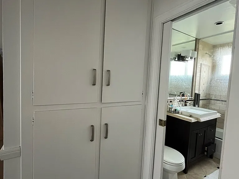 Linen closet off 1st bathroom and hallway