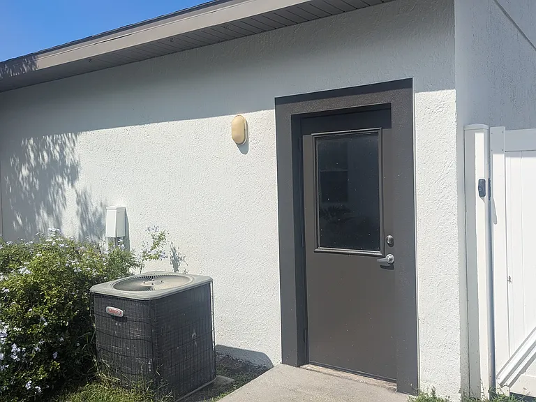 Entrance door to Garage From Back Yard