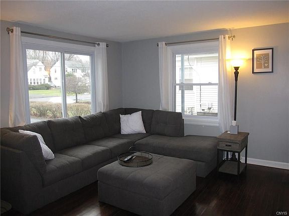 So many windows in this home!  New ones, too!  The sectional works well in the living room.