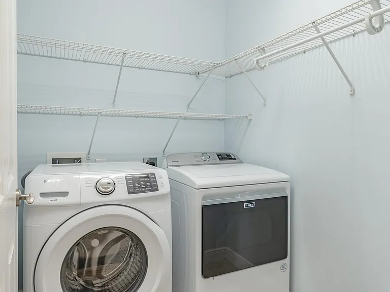 Spacious laundry room. The washer and dryer will stay for tenants' use.