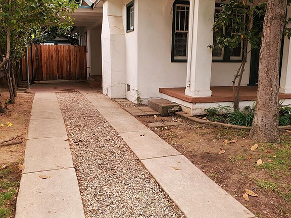Long driveway - old garage behind gate