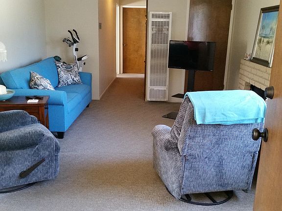 Living room with newer, plush carpet