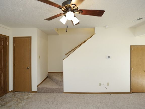 Living room with great size coat closet!