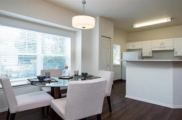 Village at Main Street | Spacious Kitchen with Adjacent Dining Room with Plank Style Flooring