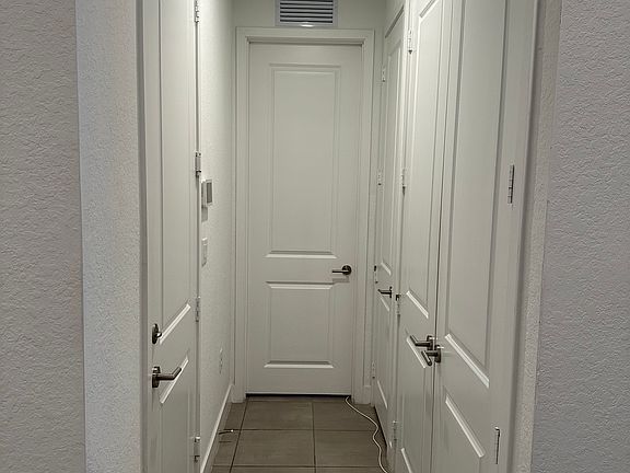 hallway to garage, bedroom 3 and laundry room